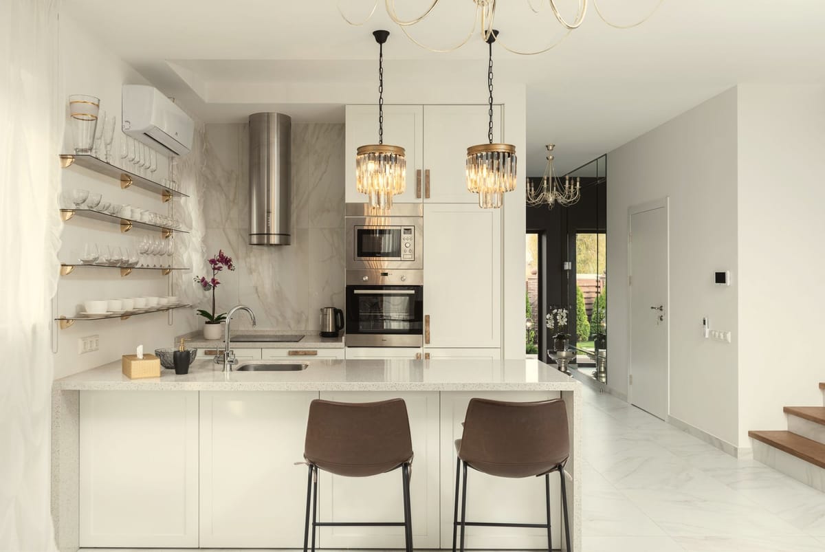 Example of a finished kitchen with pendant lights over the island