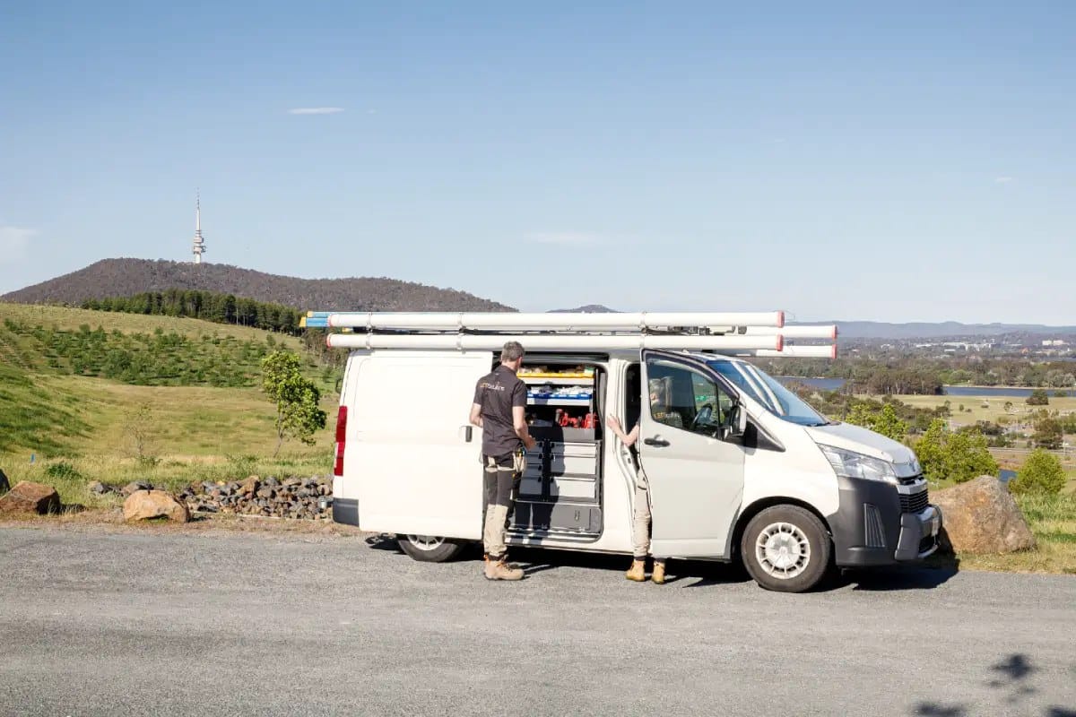 The LED Solutions van and team at a Canberra lookout, with Telstra Tower on the hill behind